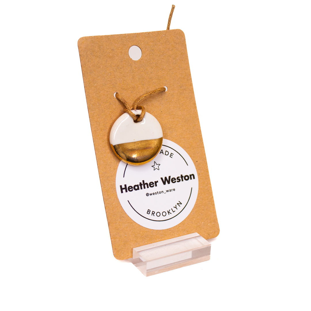 Luster gold and white ceramic charm